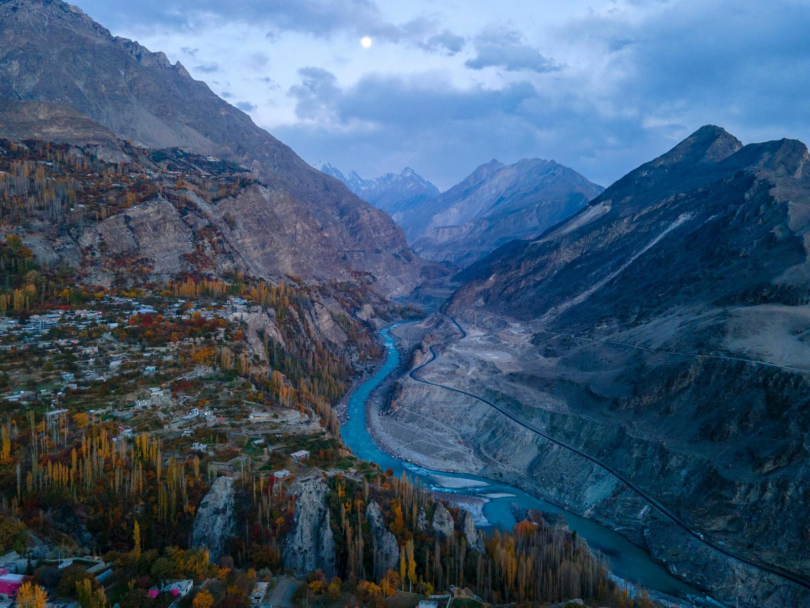 Tourism Stunning aerial view of the Hunza Valley with autumn foliage and a winding river in Pakistan.
